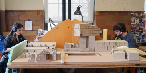 Architecture students work on projects in a lab.